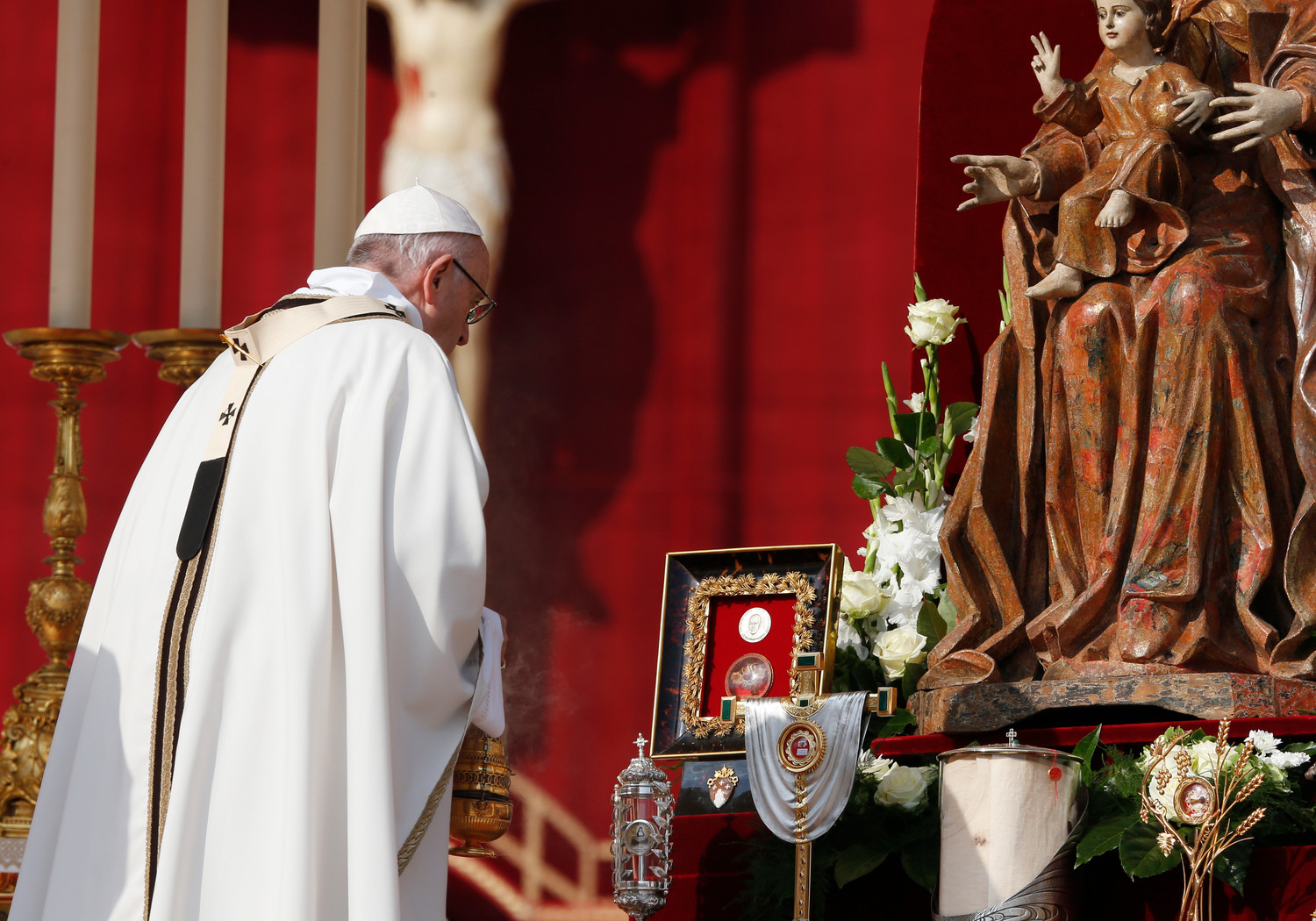 Pope Francis uses incense to venerate relics as he celebrates the canonization Mass for seven new saints in St. Peter’s Square at the Vatican Oct. 14. Among the new saints are St. Paul VI and St. Oscar Romero.